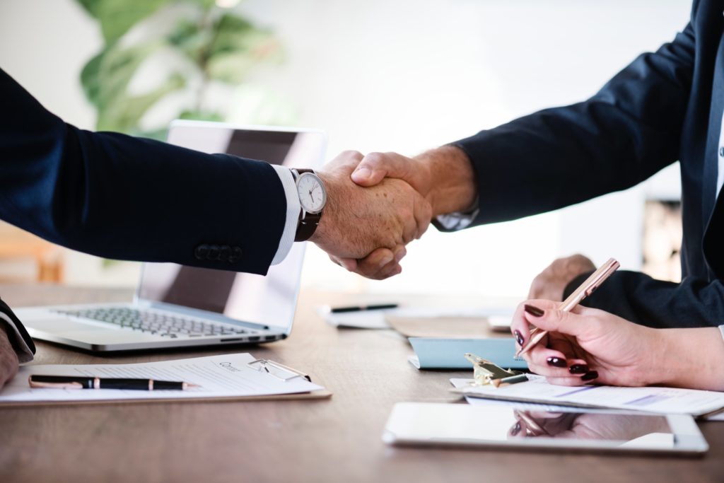 business lawyer shaking hands with client